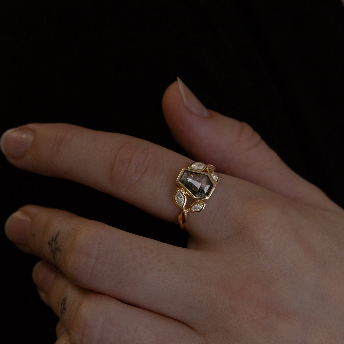Nick Von K 9 Karat Yellow Gold Ring with Coffin Shaped Salt and Pepper Diamond bezel set and accented by Marquise shaped lab diamonds and twisted vines model shot