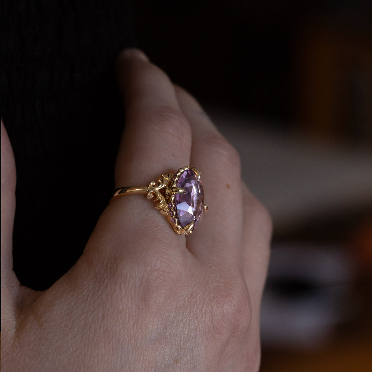 Nick Von K 9k Yellow Gold Royal Unicorn Ring with Amethyst side view model shot of fleur-de-lis claw setting and small gypsy set round cut Amethysts