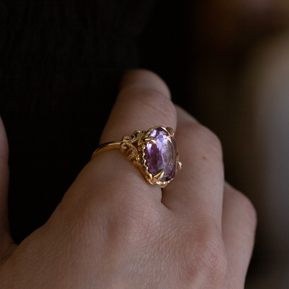 Nick Von K 9k Yellow Gold Royal Unicorn Ring with Amethyst side view model shot of fleur-de-lis claw setting and small gypsy set round cut Amethysts