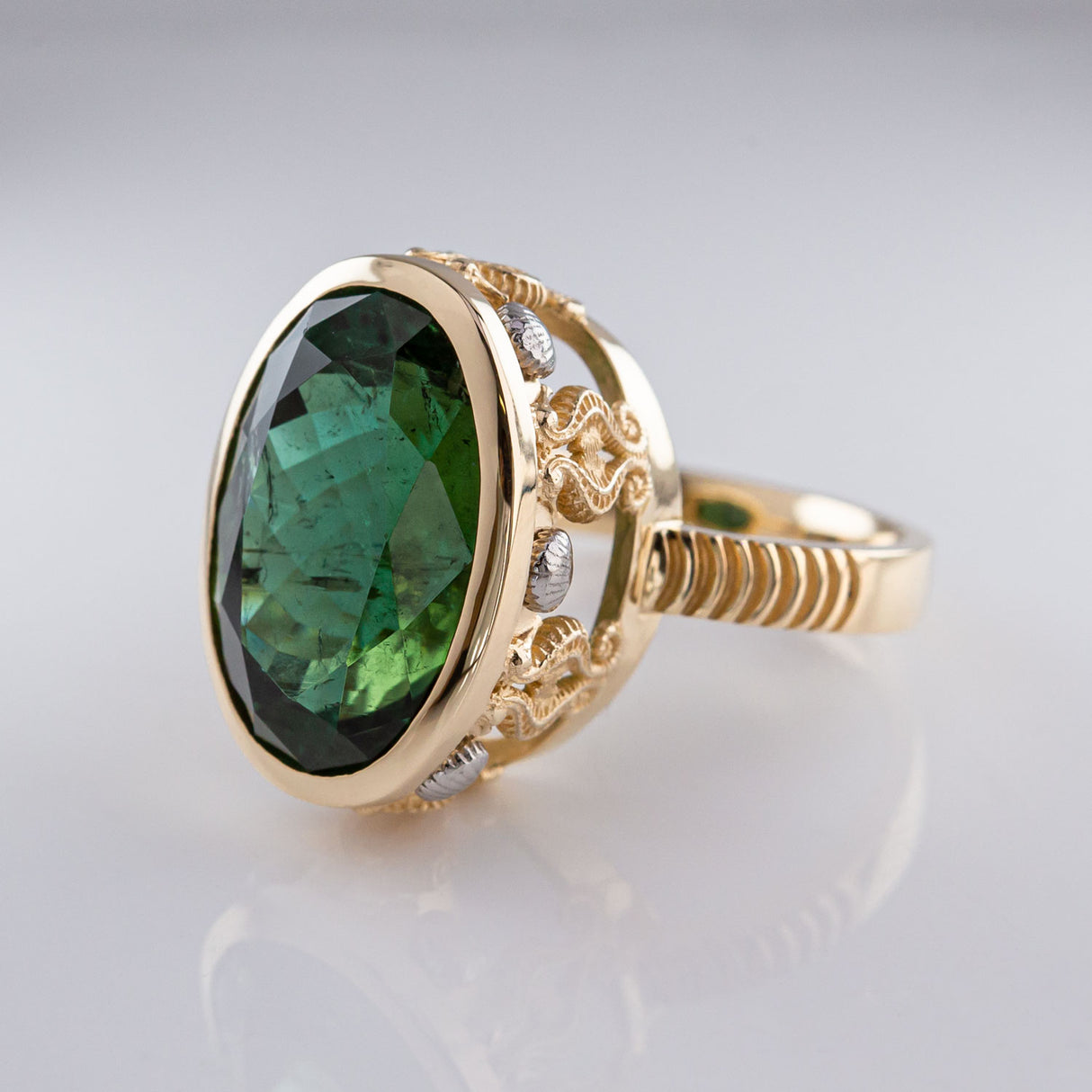 15.81 carat Teal Green Tourmaline Seahorse Temple ring in 9 carat Gold and Platinum