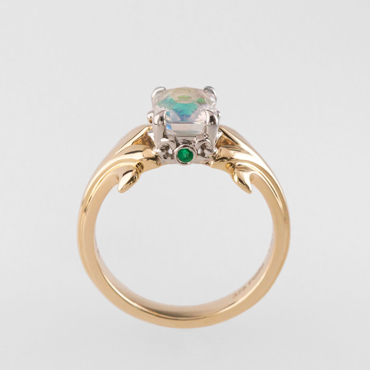 Peach Moonstone ring with Emeralds in 9 ct Gold and Platinum