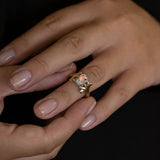 Peach Moonstone ring with Emeralds in 9 ct Gold and Platinum