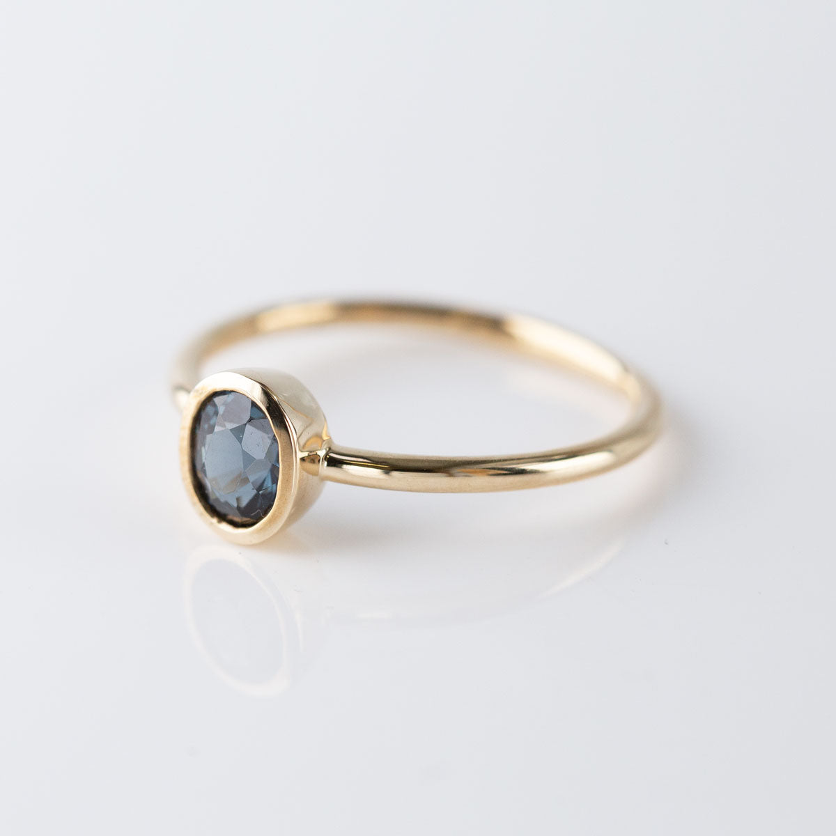 Steel Blue Oval Tourmaline Tiny Treasure Ring in 9 carat Yellow Gold