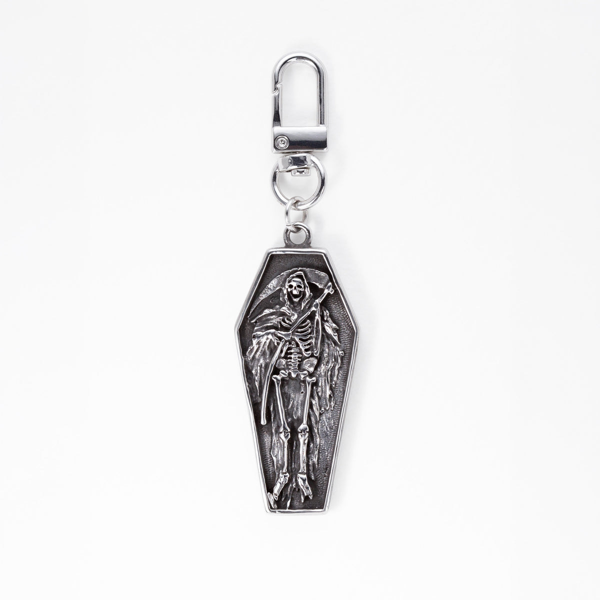 A stainless steel coffin-shaped bag charm keychain featuring an embossed skeleton reaper figure, complete with a lobster clasp at the top, shown against a plain white background.