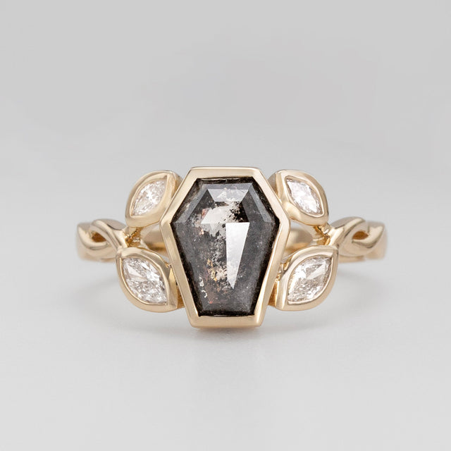 Nick Von K 9 Karat Yellow Gold Ring with Coffin Shaped Salt and Pepper Diamond bezel set and accented by Marquise shaped lab diamonds and twisted vines front angle 