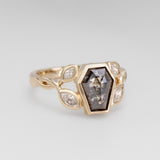 Nick Von K 9 Karat Yellow Gold Ring with Coffin Shaped Salt and Pepper Diamond bezel set and accented by Marquise shaped lab diamonds and twisted vines side angle