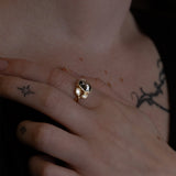 Nick Von K 9 Karat Yellow Gold Ring with Coffin Shaped Salt and Pepper Diamond bezel set and accented by Marquise shaped lab diamonds and twisted vines side angle model shot