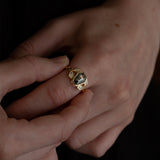 Nick Von K 9 Karat Yellow Gold Ring with Coffin Shaped Salt and Pepper Diamond bezel set with star cut out and accented by Marquise shaped lab diamonds and twisted vines side angle