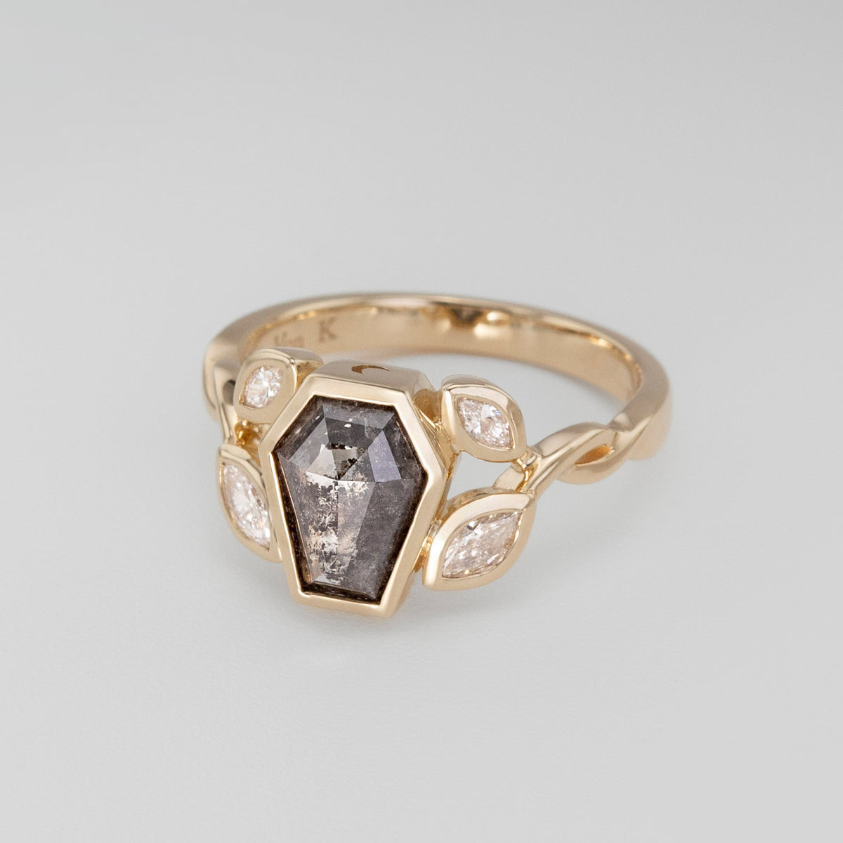 Nick Von K 9 Karat Yellow Gold Ring with Coffin Shaped Salt and Pepper Diamond bezel set with moon cut out and accented by Marquise shaped lab diamonds and twisted vines side angle