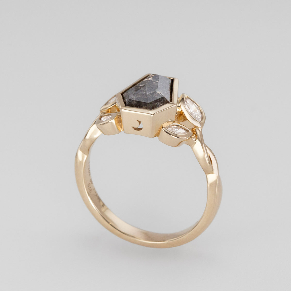 Nick Von K 9 Karat Yellow Gold Ring with Coffin Shaped Salt and Pepper Diamond bezel set with moon cut out and accented by Marquise shaped lab diamonds and twisted vines side angle