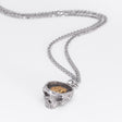 Angled front view of the Nick Von K Rebirth charm necklace with a sculpted skull pendant on a silver chain.