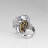 Rear view of the Nick Von K Rebirth skull ring showing a gold-outlined coffin with a skeletal reaper and scythe.