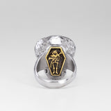 Rear view of the Nick Von K Rebirth skull ring showing a gold-outlined coffin with a skeletal reaper and scythe.