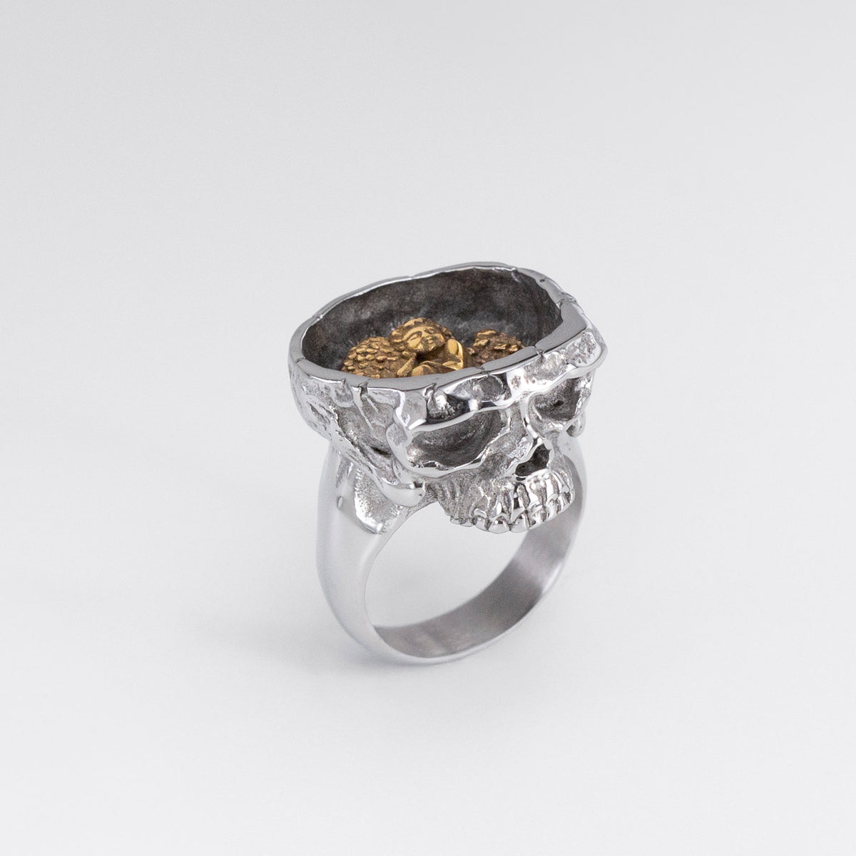 Front view of the Nick Von K Rebirth ring with a sculpted silver-toned skull face and smooth band.