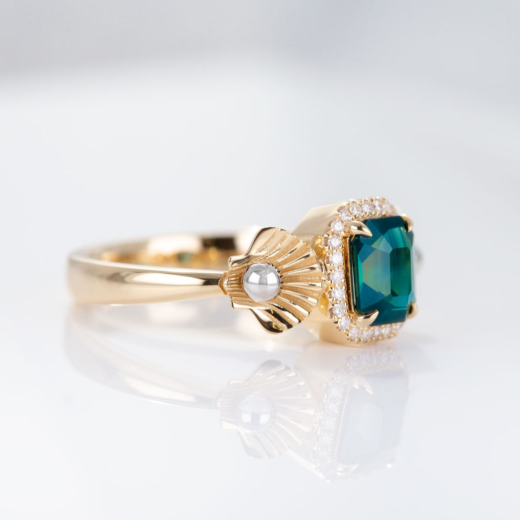 1.31 carat Emerald cut Teal Sapphire Ariel ring in 18 carat Yellow Gold with Platinum and Diamonds
