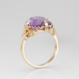 Nick Von K 9k Yellow Gold Royal Unicorn Ring with Amethyst side view of fleur-de-lis claw setting and small gypsy set round cut Amethysts