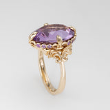 Nick Von K 9k Yellow Gold Royal Unicorn Ring with Amethyst side view of fleur-de-lis claw setting and small gypsy set round cut Amethysts