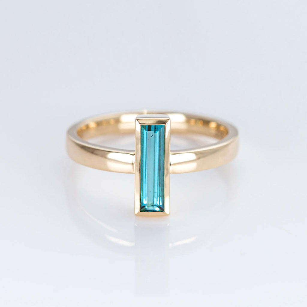 Blue Tourmaline Capsule ring in 9 carat Yellow Gold