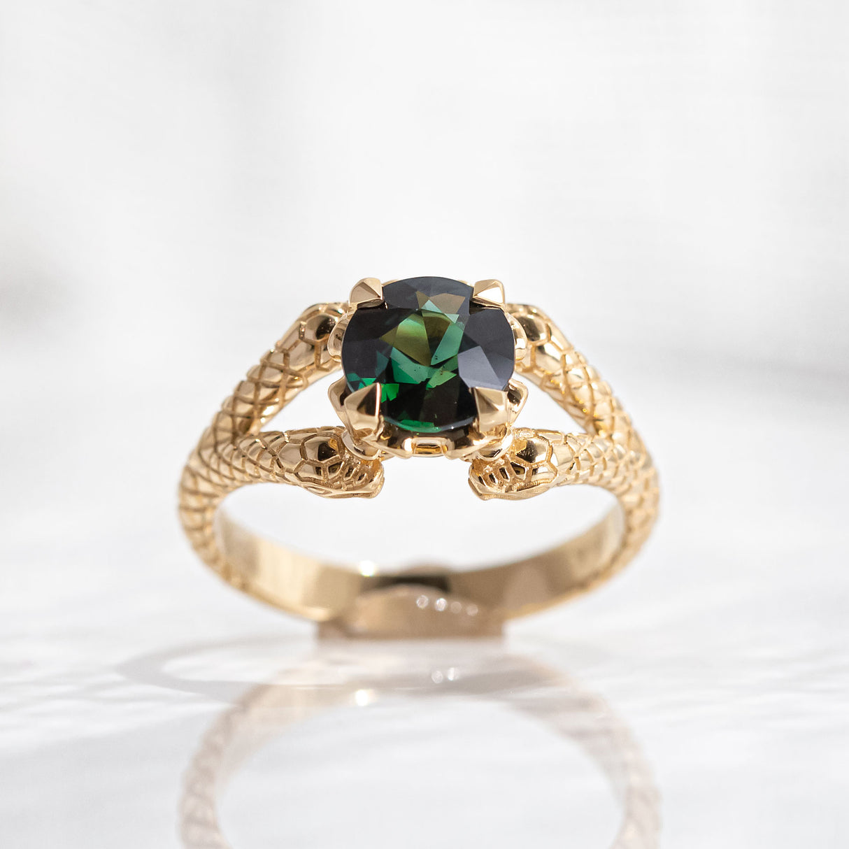 1.55 carat Deep Green Teal Sapphire Double Snake ring in 18 carat Yellow Gold