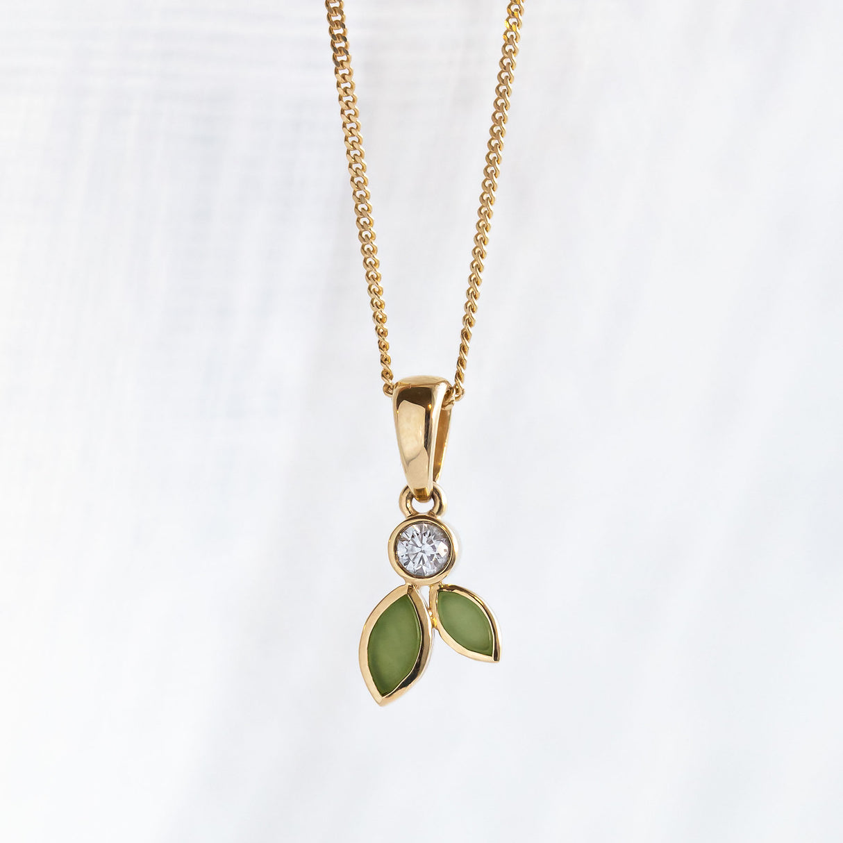 Pounamu and Diamond Blossom pendant in 9 carat Yellow Gold